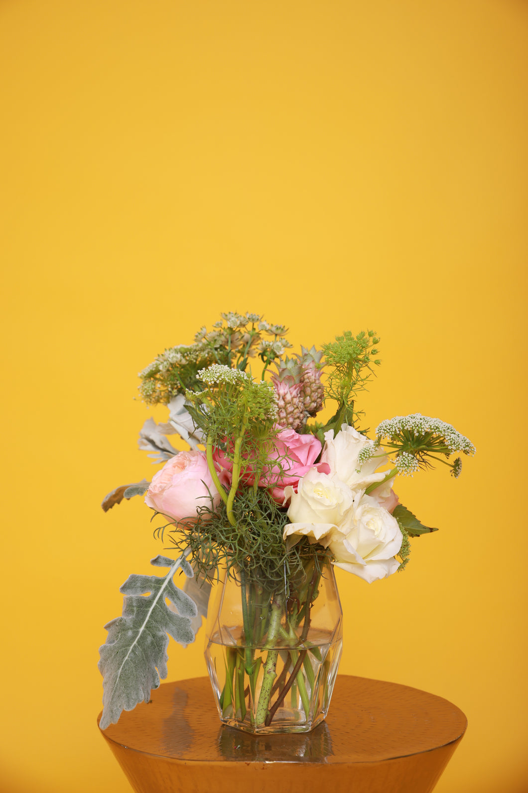 Clear Geometric Vase with whimsical greenery and seasonal flowers